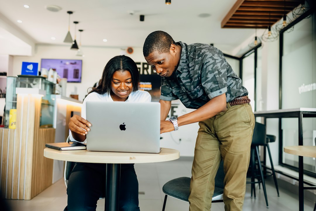 Black professionals planning an automation workflow
